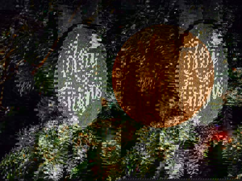 Image depicting a Christmas bauble in a tree