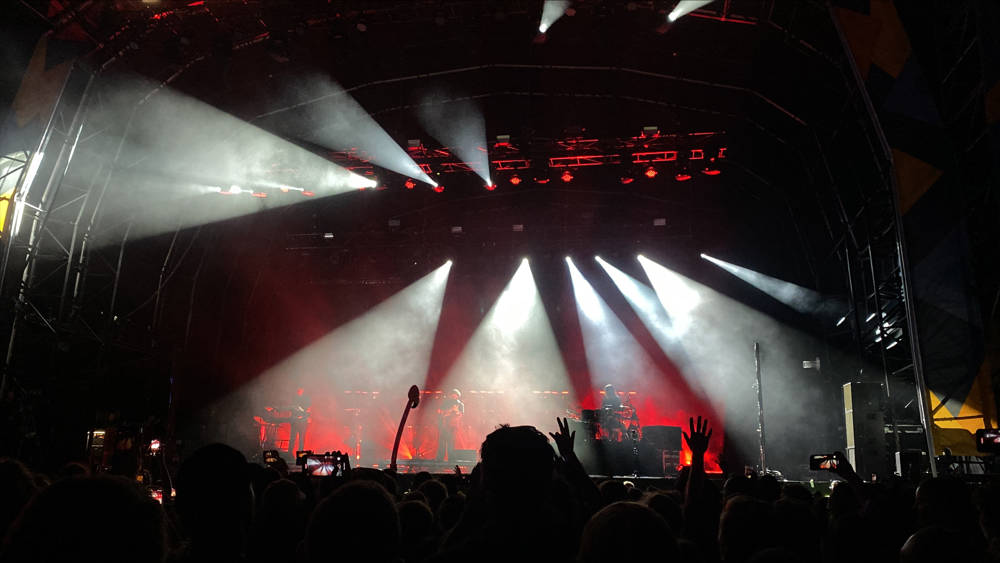 Victorious Festival main stage lit up at night with band playing