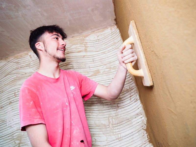 Plastering student working in the plastering workshop at North Harbour Campus