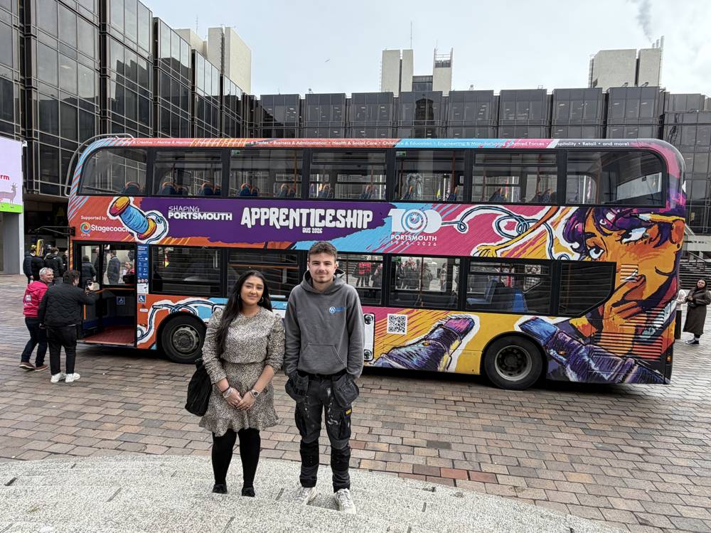 COPC apprentices Chelsea Kaur and Barney Willis in front of the Apprenticeship Bus