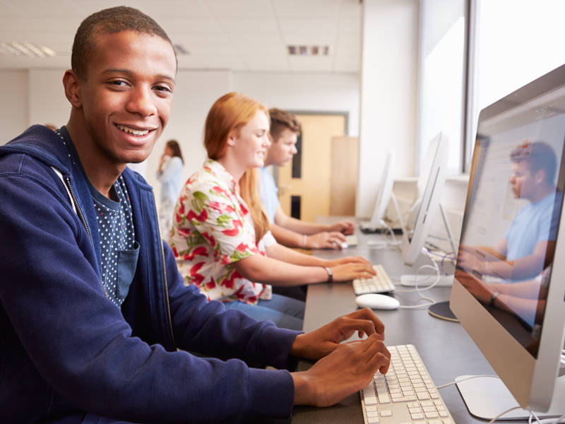 College Students Using Computers On Media Studies Course.