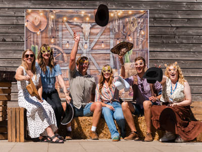 A group of COPC staff celebrating at the western themed staff party 
