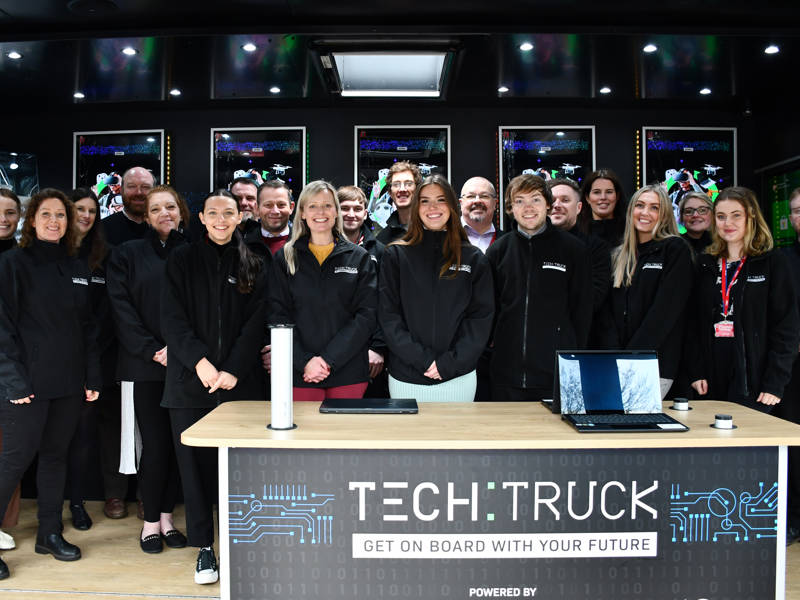 Tech Truck instructors stood smiling in the Tech Truck.