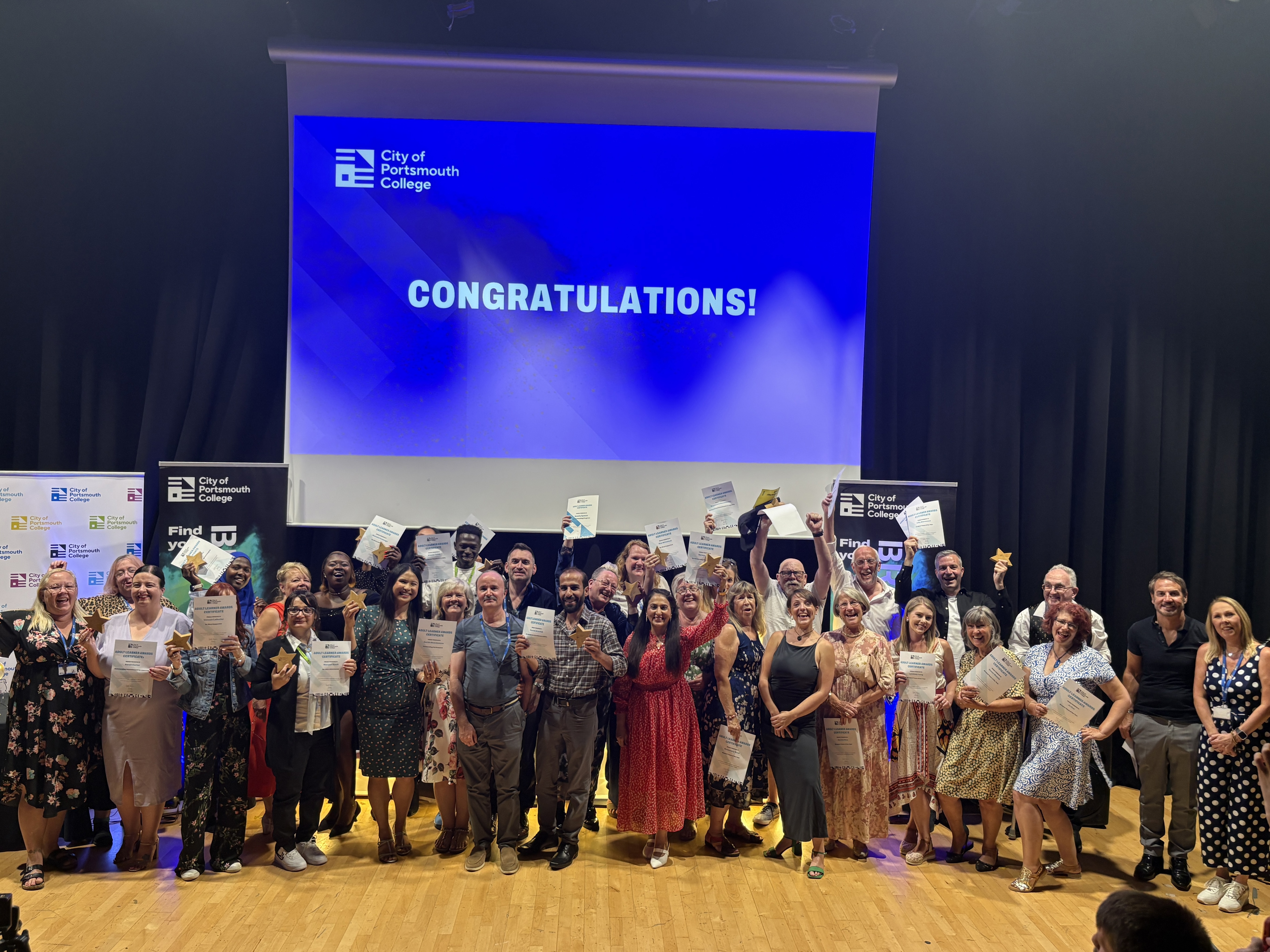 All the winners from the 2026 Adult Learner Awards pose for a group picture
