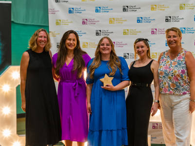 Four award winners standing with Katy Quinn, Principal of City of Portsmouth College at the Staff Awards